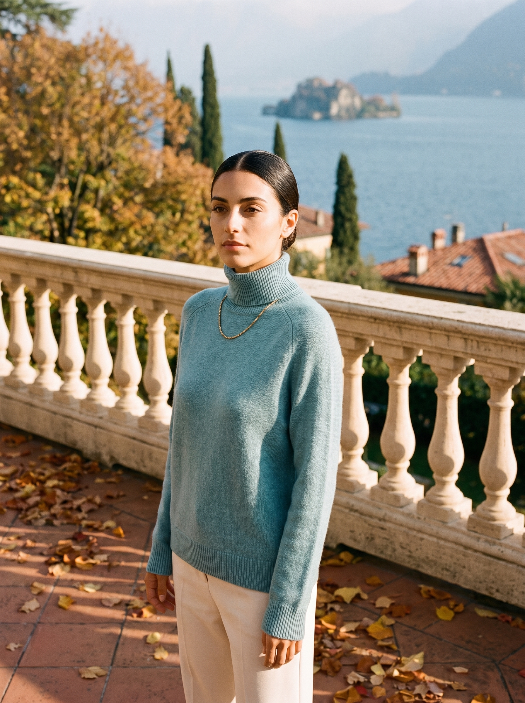 Woman wearing a misty blue women's turtleneck sweater by Lake Como - Aveloire