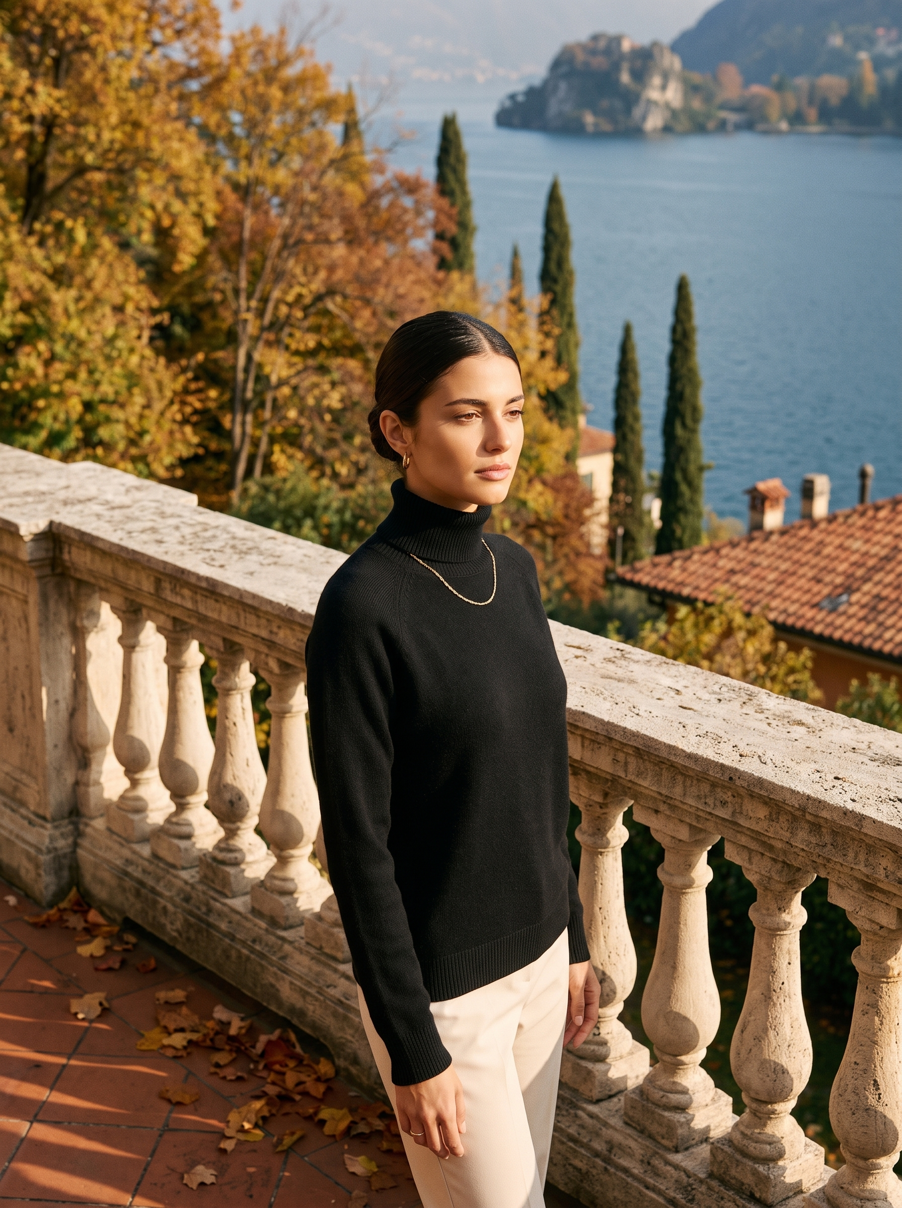 Woman wearing a black women's turtleneck sweater on a Lake Como terrace - Aveloire