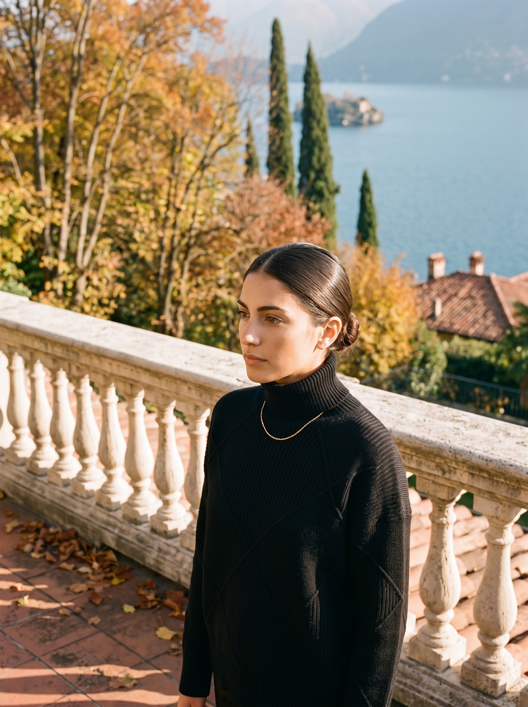 Woman wearing a black cable knit turtleneck sweater by Lake Como — Aveloire