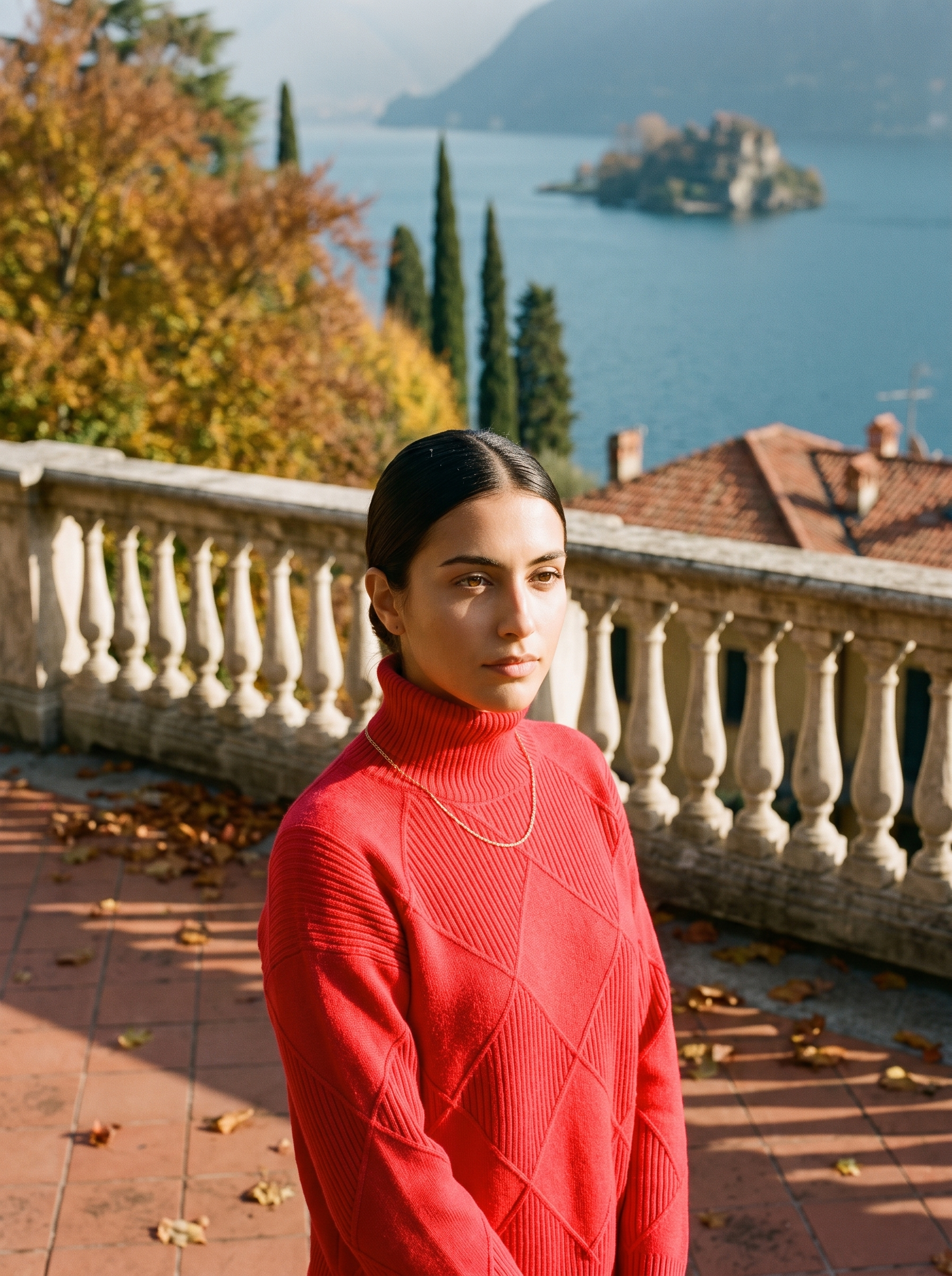 Woman wearing a red cable knit turtleneck sweater by Lake Como — Aveloire