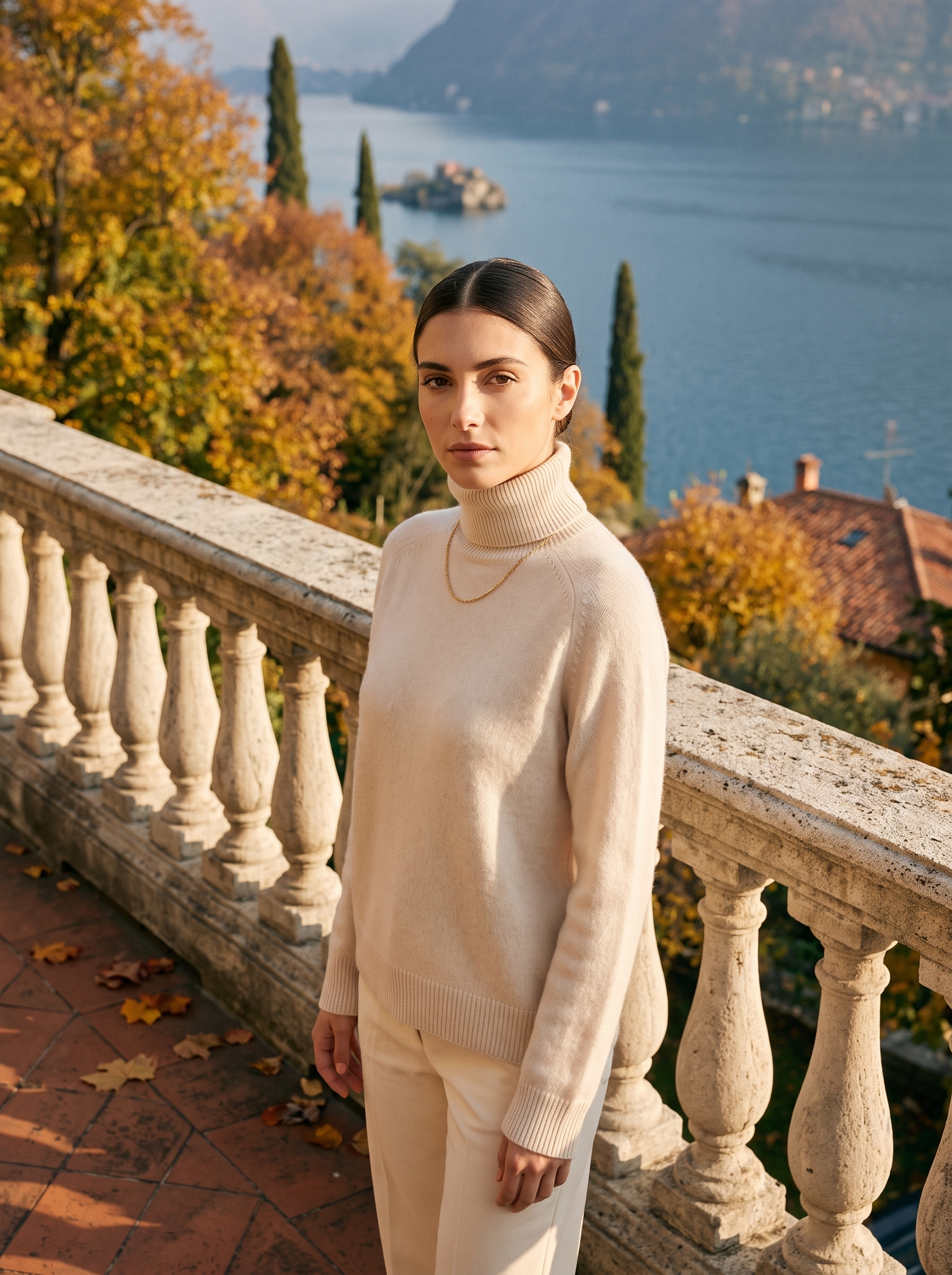 Woman wearing a cream women's turtleneck sweater on a Lake Como terrace - Aveloire