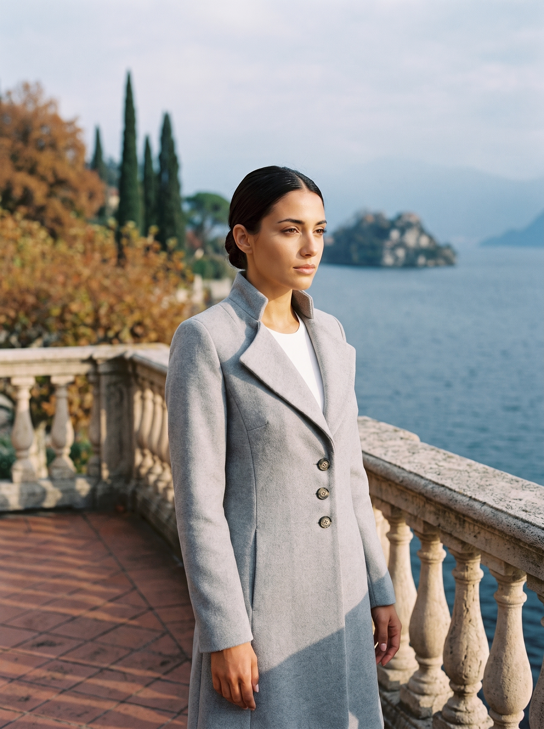 Light gray ladies overcoat, worn on a Lake Como terrace — Aveloire