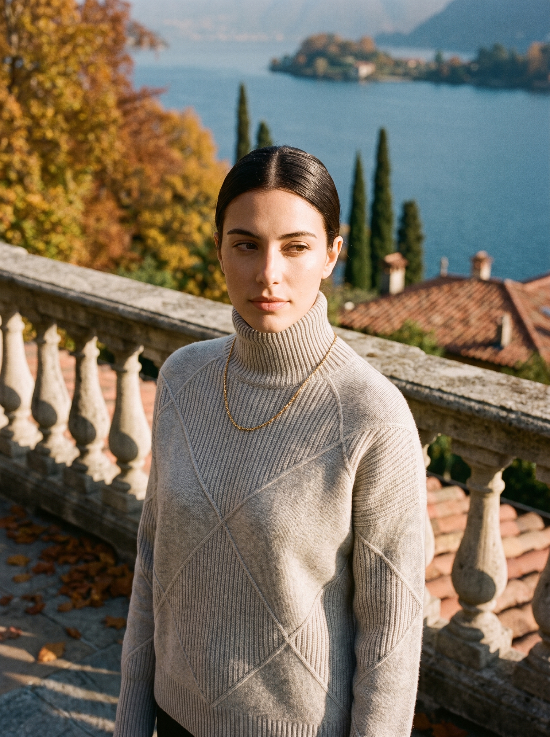 Woman wearing a light gray cable knit turtleneck sweater by Lake Como — Aveloire