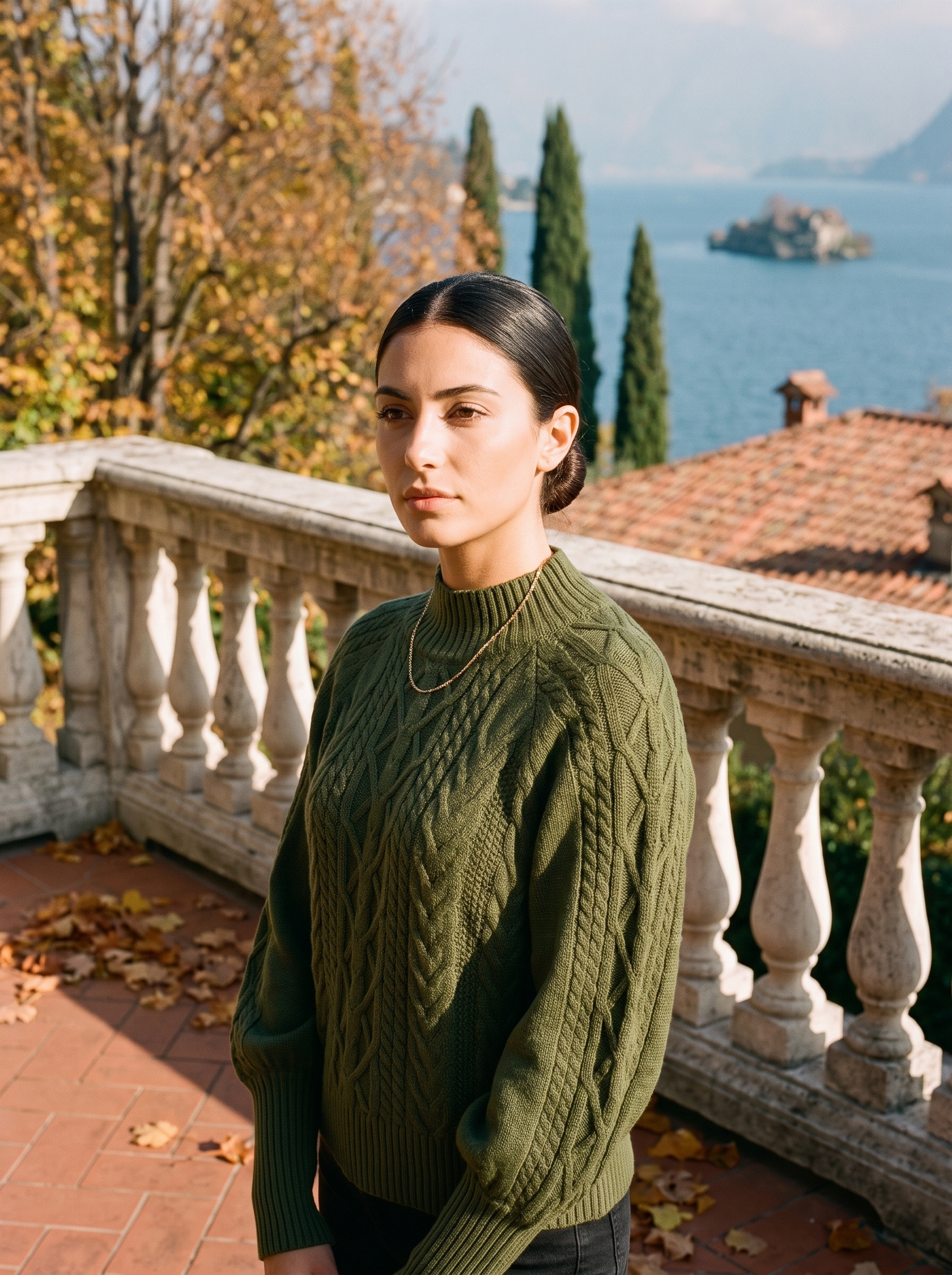 Woman wearing an army green cable knit mock neck sweater by Lake Como — Aveloire