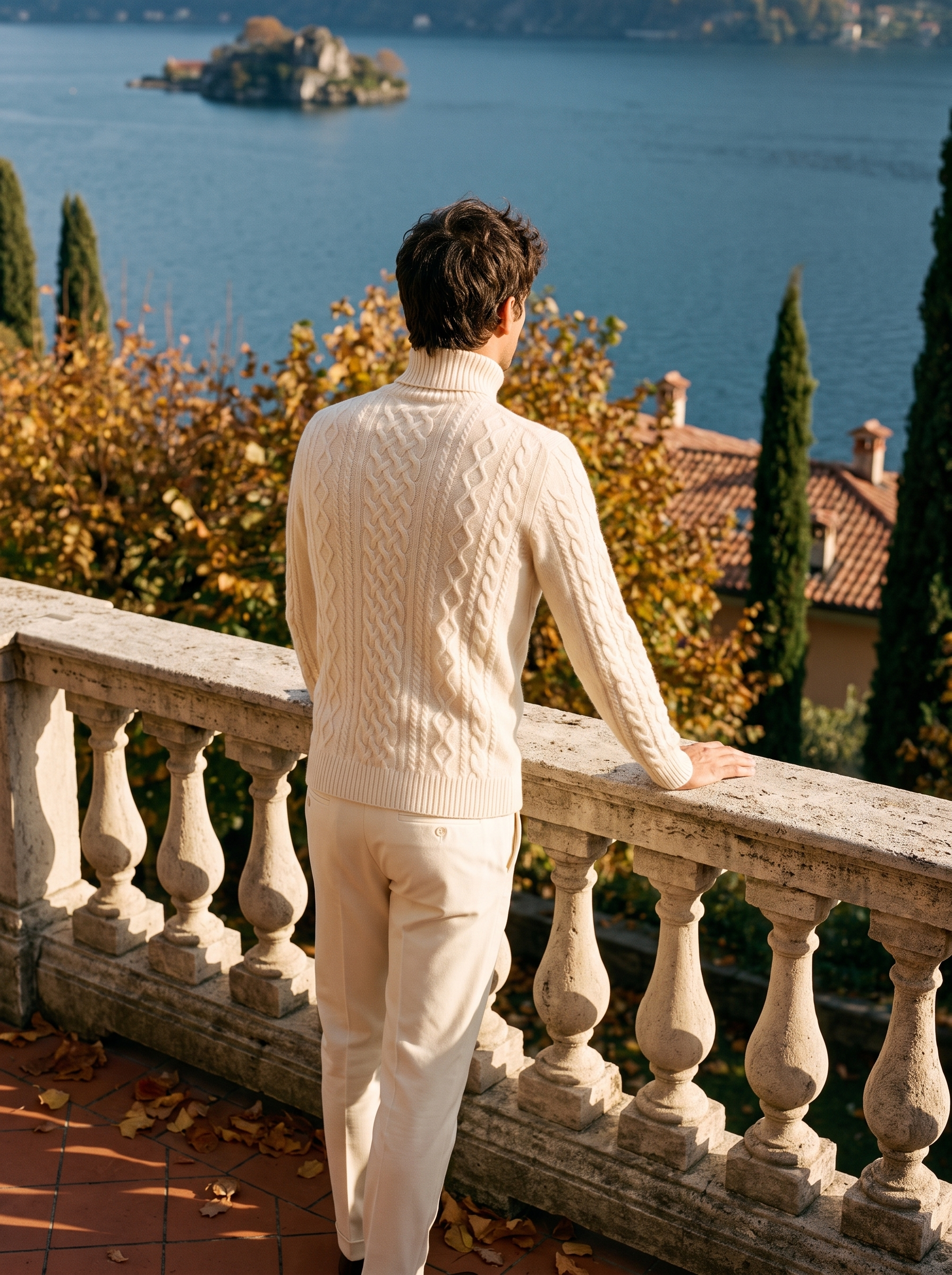Cream wool cable knit turtleneck sweater on model, back view — Aveloire