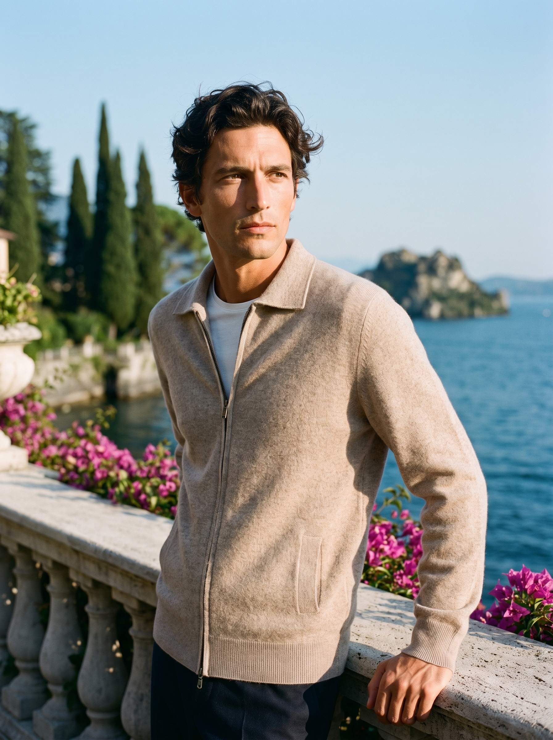 Man wearing a beige mercerized wool zip-up collared cardigan on a terrace overlooking Lake Como, old money style — Aveloire
