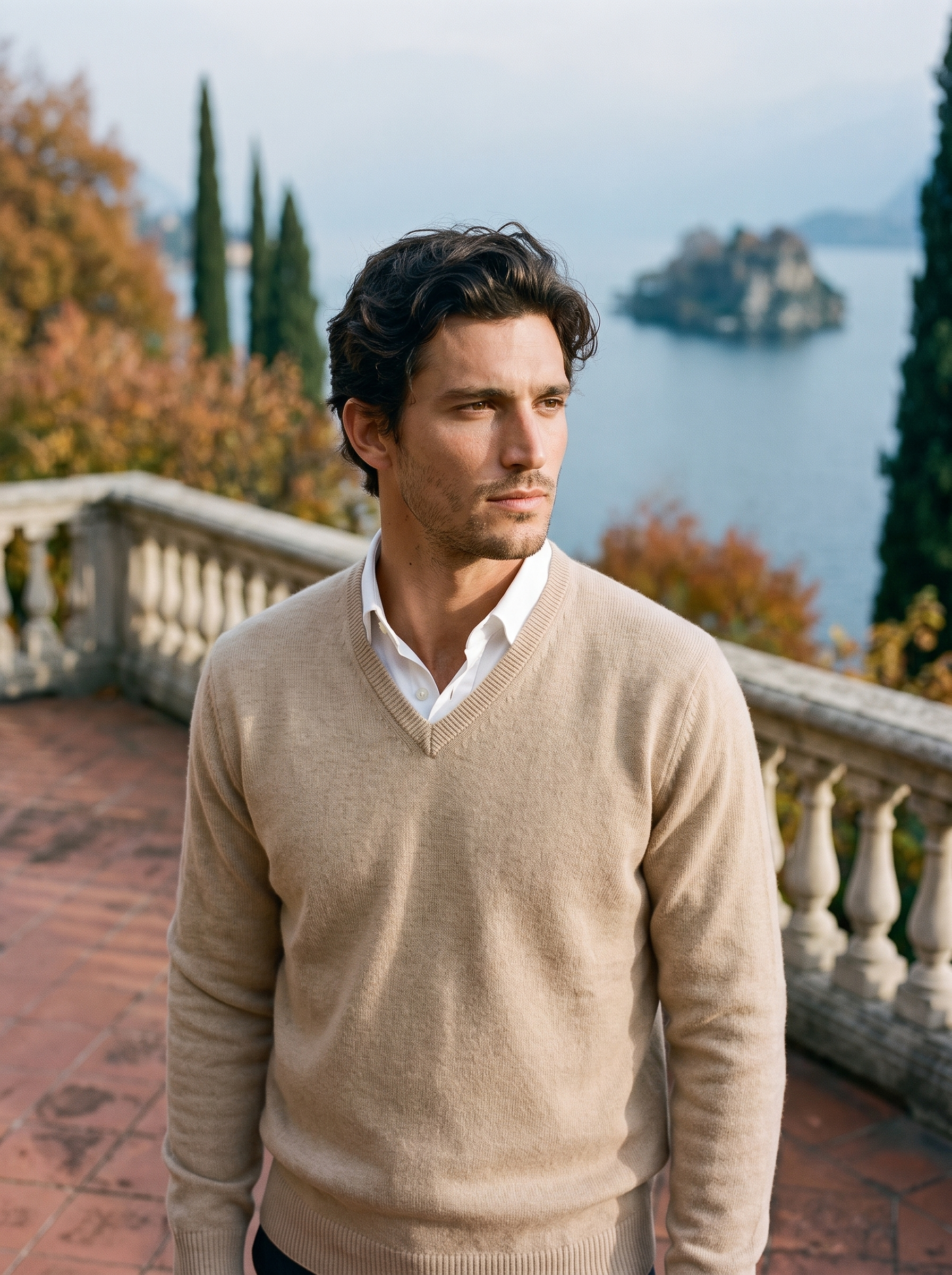 Beige wool v neck sweater for men, worn on a Lake Como terrace — Aveloire