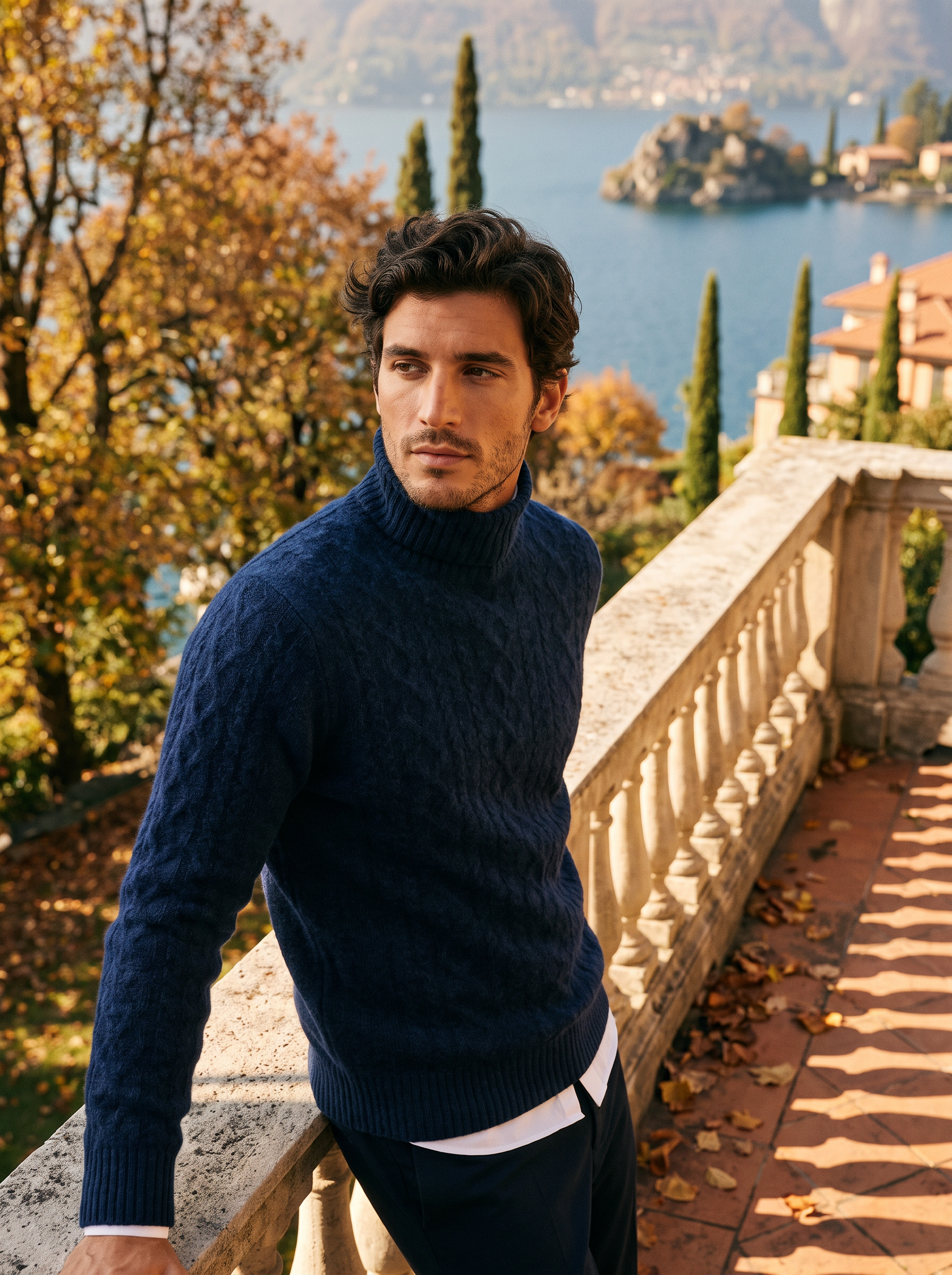 Man wearing a navy blue wool cable knit turtleneck sweater by Lake Como — Aveloire