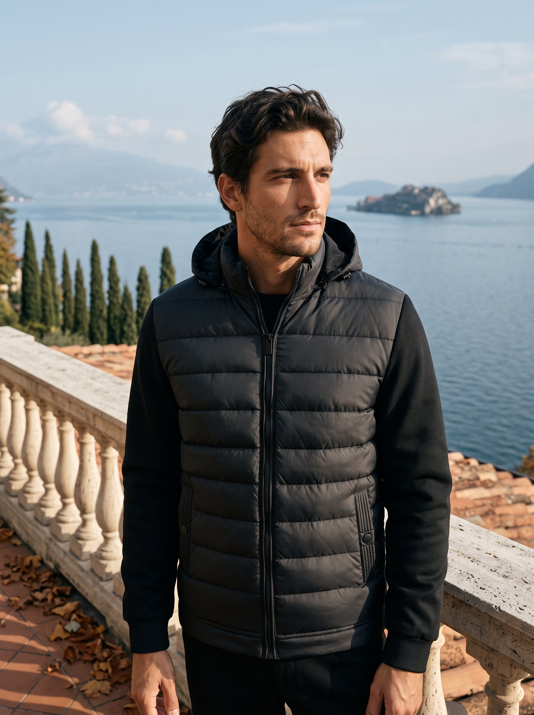 Black down puffer jacket for men, worn on a Lake Como terrace — Aveloire