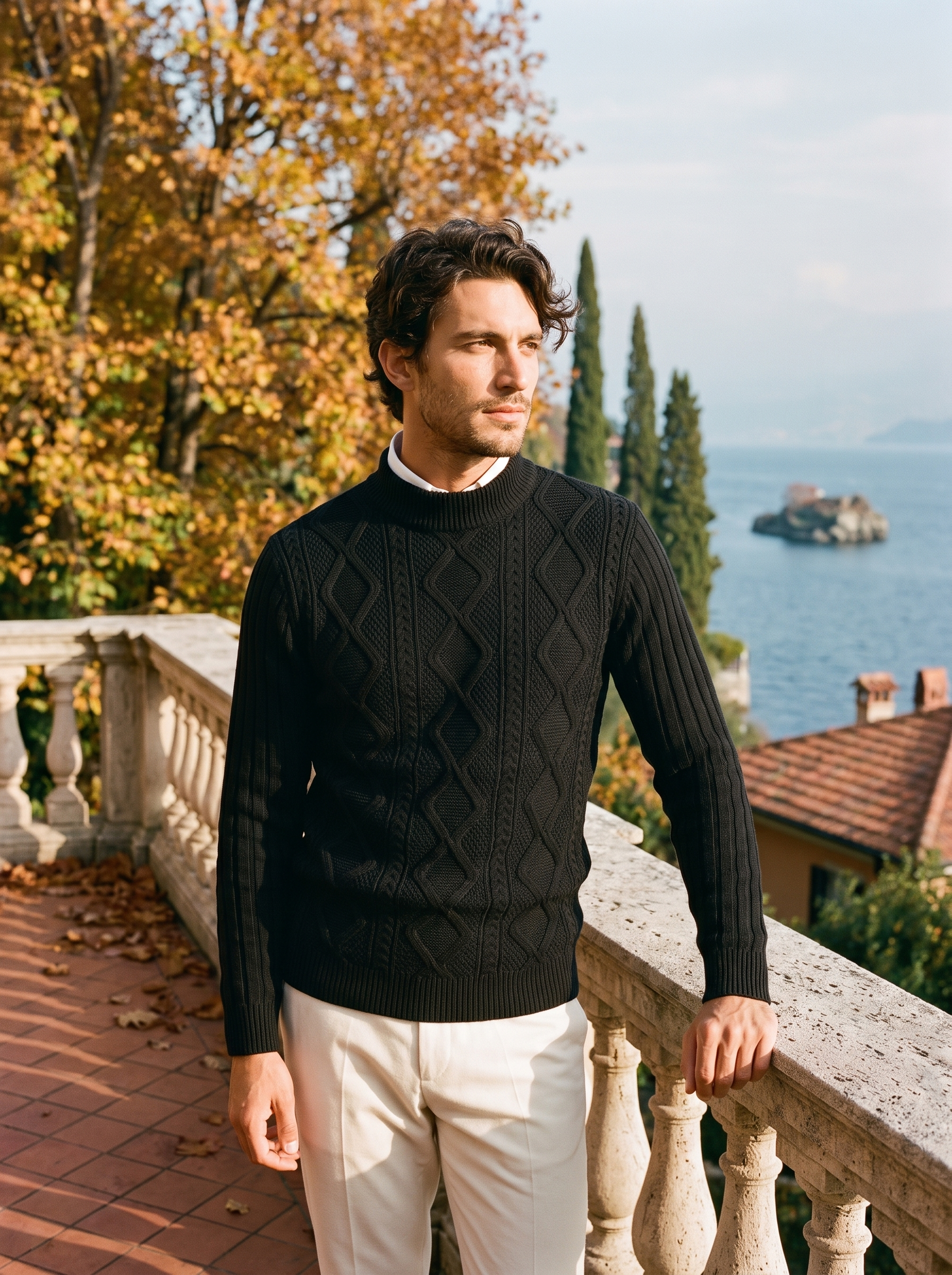 Man wearing a black cable knit mock neck sweater on a terrace by Lake Como - Aveloire