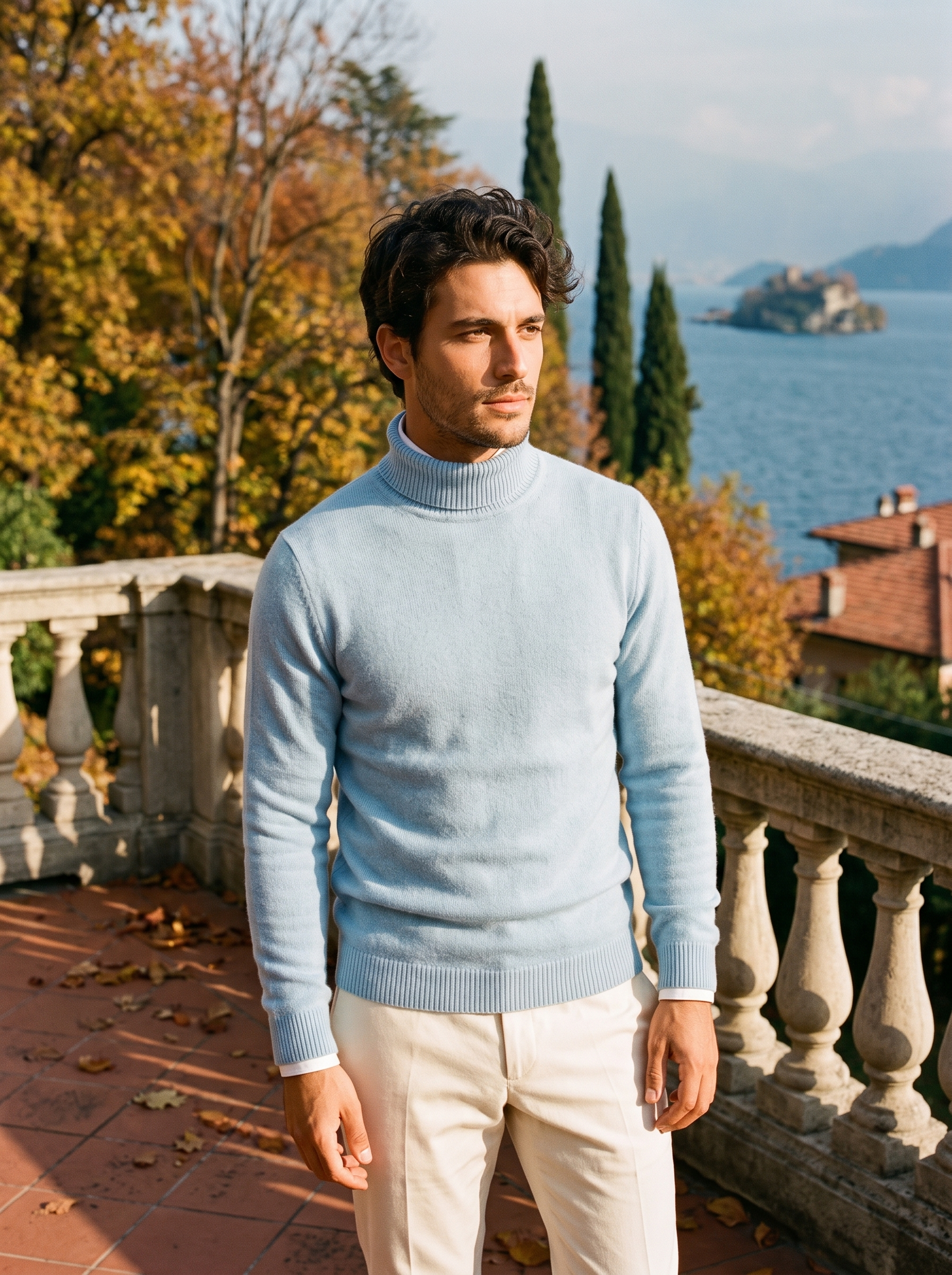 Man wearing a misty blue wool turtleneck sweater by Lake Como — Aveloire