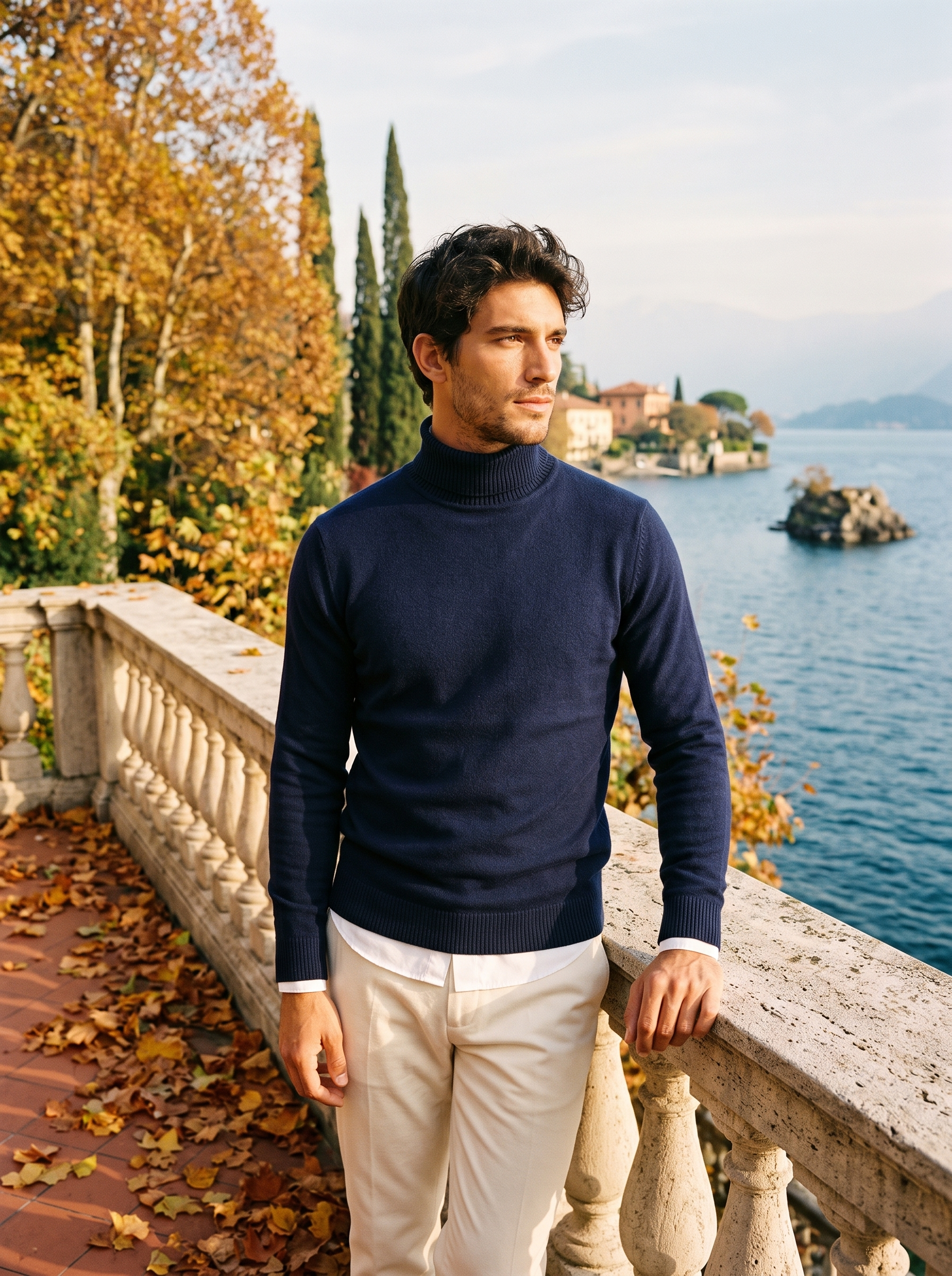 Man wearing a navy wool turtleneck sweater by Lake Como — Aveloire