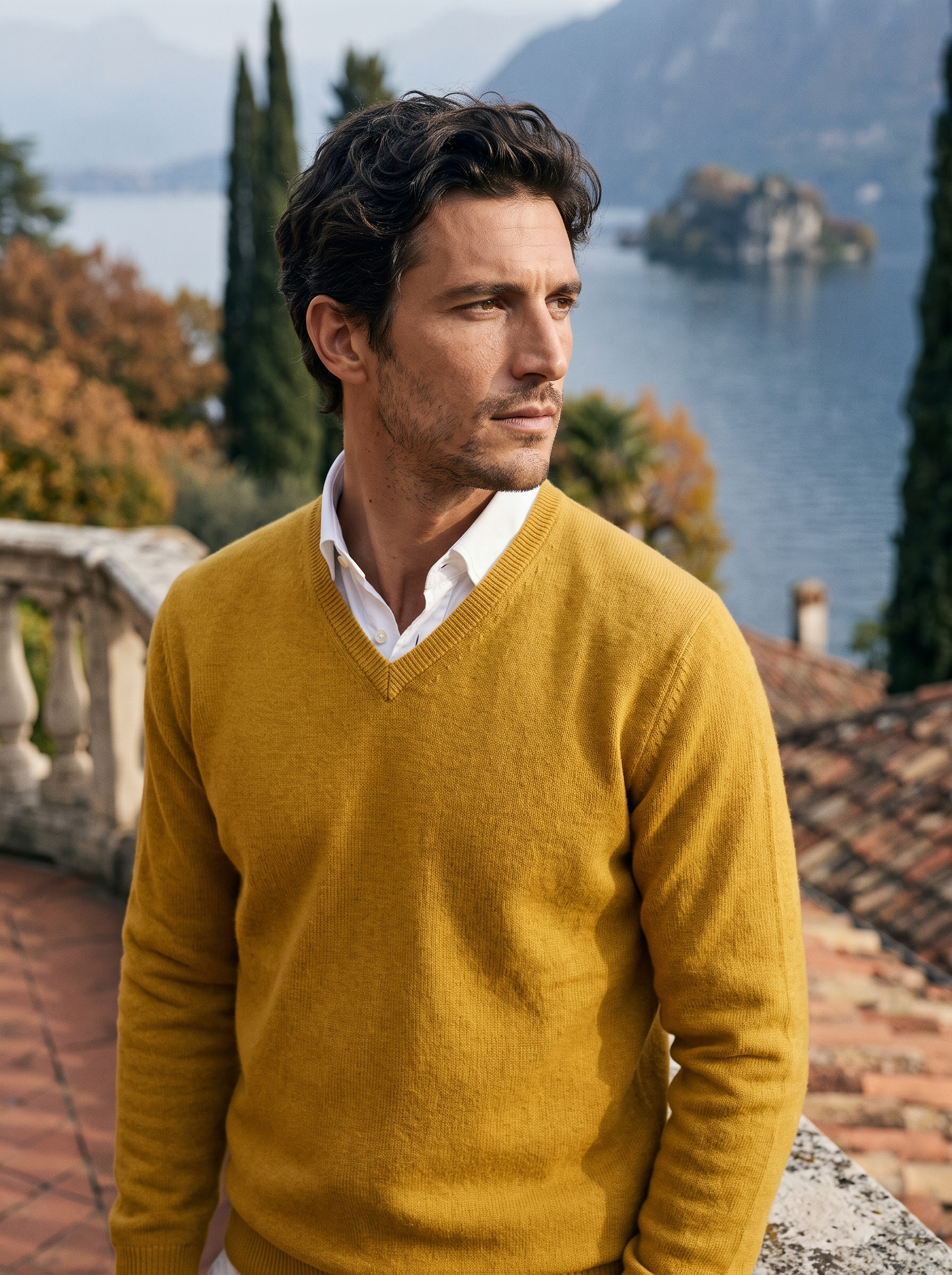 Mustard wool v neck sweater for men, worn on a Lake Como terrace — Aveloire